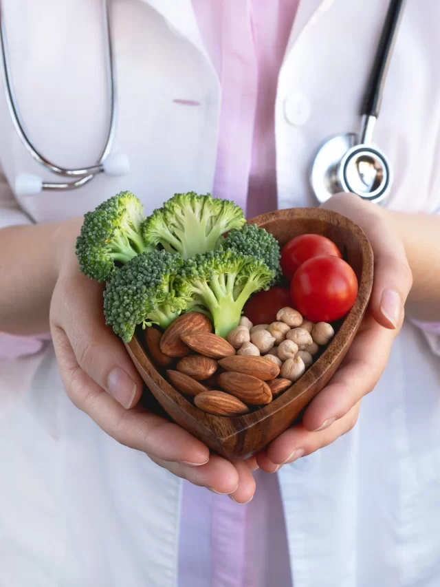 healthy-food-heart-diet-concept-doctor-holding-bowl-with-vegetables-nuts-chickpea