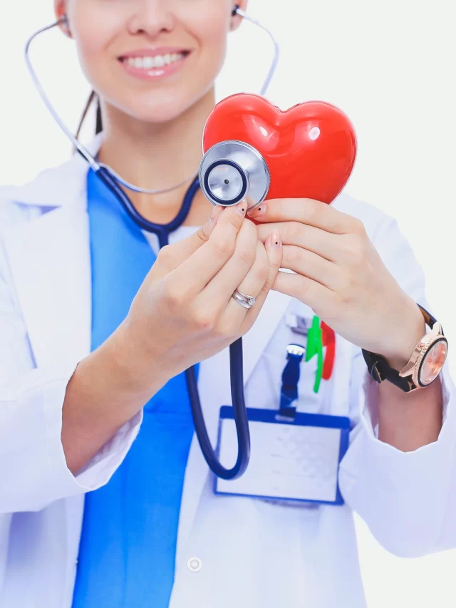 positive-female-doctor-standing-with-stethoscope-red-heart-symbol-isolated-woman-doctor